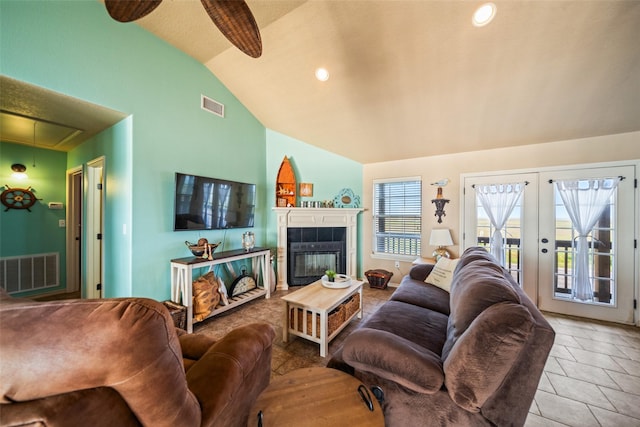 3190 Fm-2031, Matagorda, TX 77414 - living room featuring attic access, a fireplace, and high vaulted ceiling
