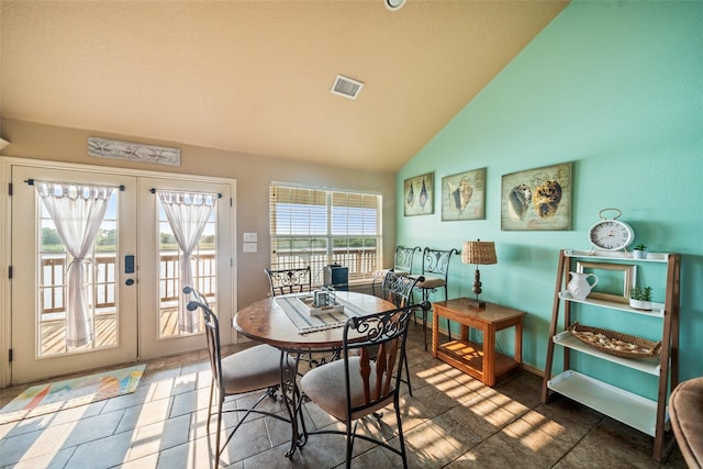 3190 Fm-2031, Matagorda, TX 77414 - dining room with french doors, high vaulted ceiling, baseboards, and tile patterned floors
