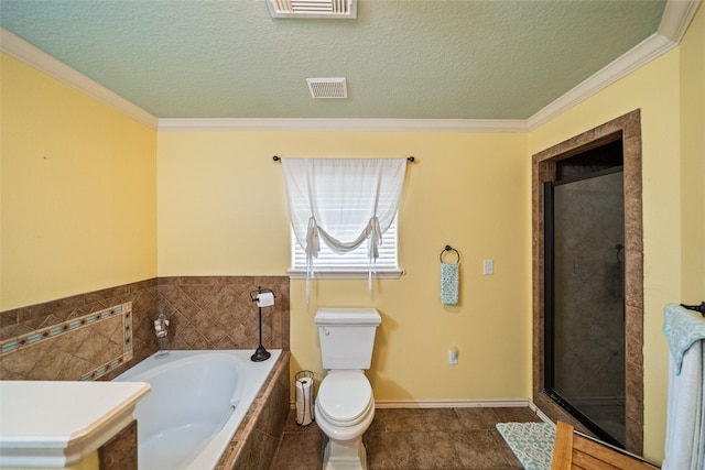 3190 Fm-2031, Matagorda, TX 77414 - bathroom featuring a garden tub, toilet, a stall shower, a textured ceiling, and ornamental molding