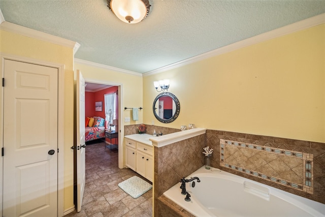 3190 Fm-2031, Matagorda, TX 77414 - ensuite bathroom featuring vanity, ornamental molding, a bath, a textured ceiling, and stone finish floors