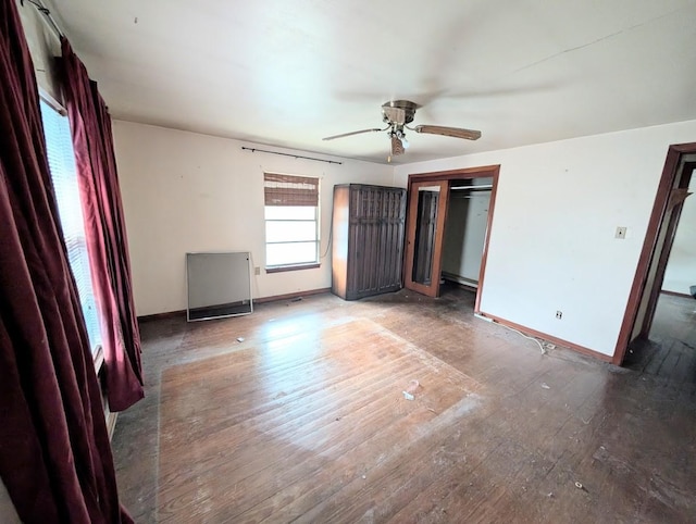 622 Gazin St, Houston, TX 77020 - unfurnished bedroom featuring hardwood / wood-style flooring, baseboards, a closet, and a ceiling fan