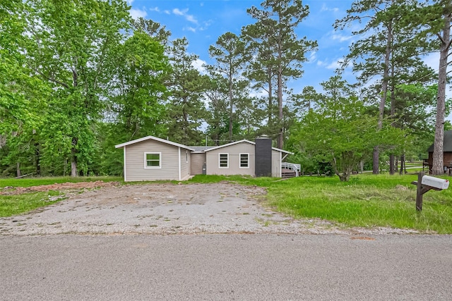 131 Holiday Blvd, Coldspring, TX 77331 - view of front of home with a chimney