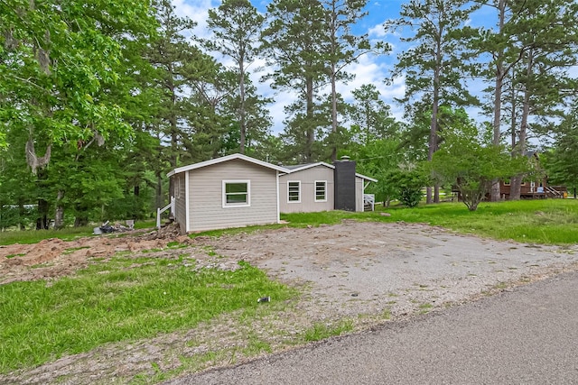 131 Holiday Blvd, Coldspring, TX 77331 - view of front of property with a chimney