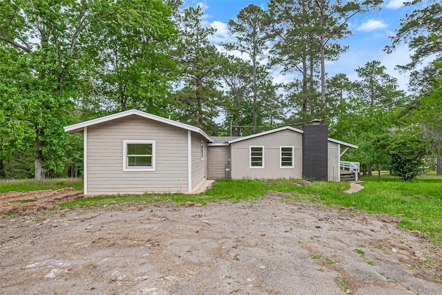 131 Holiday Blvd, Coldspring, TX 77331 - view of front of home with a chimney