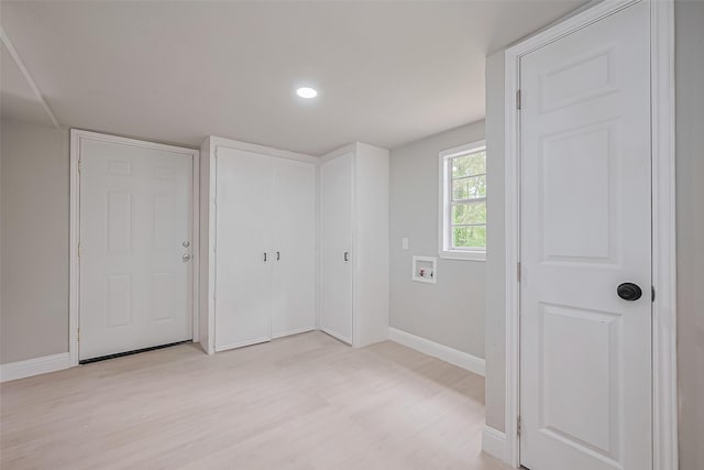 131 Holiday Blvd, Coldspring, TX 77331 - laundry area featuring baseboards, light wood-style flooring, washer hookup, and recessed lighting