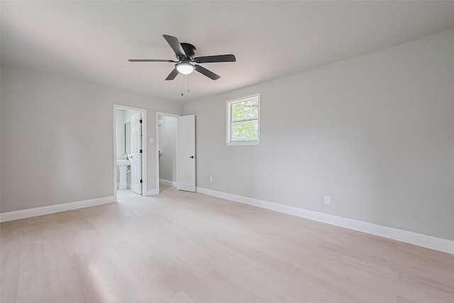 131 Holiday Blvd, Coldspring, TX 77331 - empty room with light wood finished floors, baseboards, and a ceiling fan