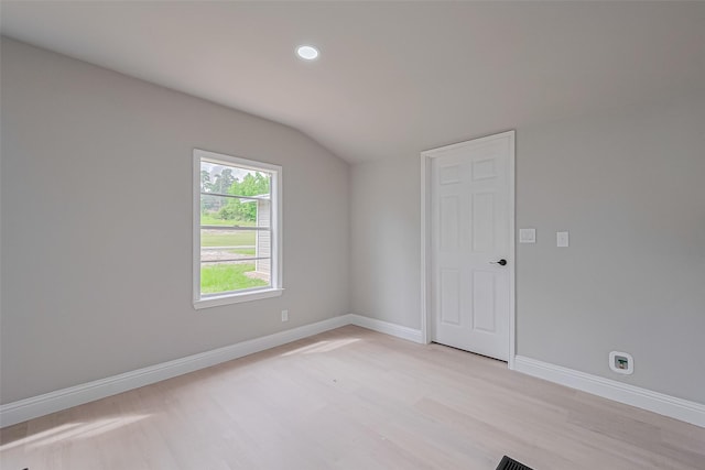 131 Holiday Blvd, Coldspring, TX 77331 - unfurnished room with lofted ceiling, light wood-type flooring, baseboards, and recessed lighting