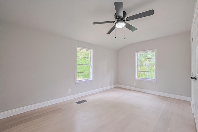 131 Holiday Blvd, Coldspring, TX 77331 - spare room featuring plenty of natural light, light wood-type flooring, baseboards, and lofted ceiling