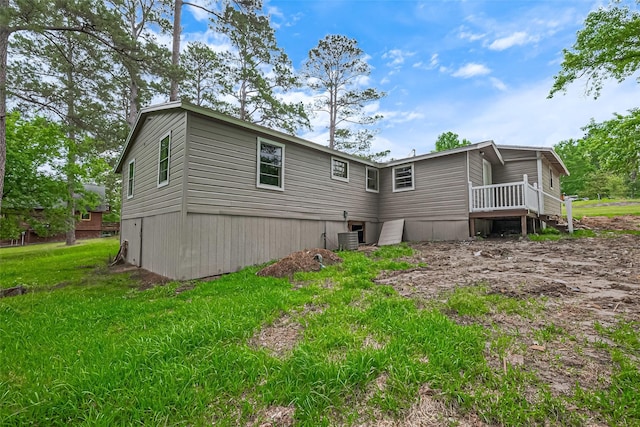 131 Holiday Blvd, Coldspring, TX 77331 - rear view of property with cooling unit