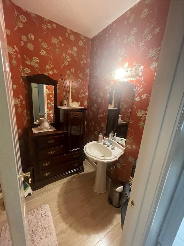17518 Jackson Pnes, Houston, TX 77090 - half bathroom featuring wood finished floors and wallpapered walls