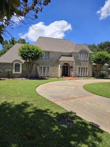 17518 Jackson Pnes, Houston, TX 77090 - french country home featuring a front lawn and stone siding