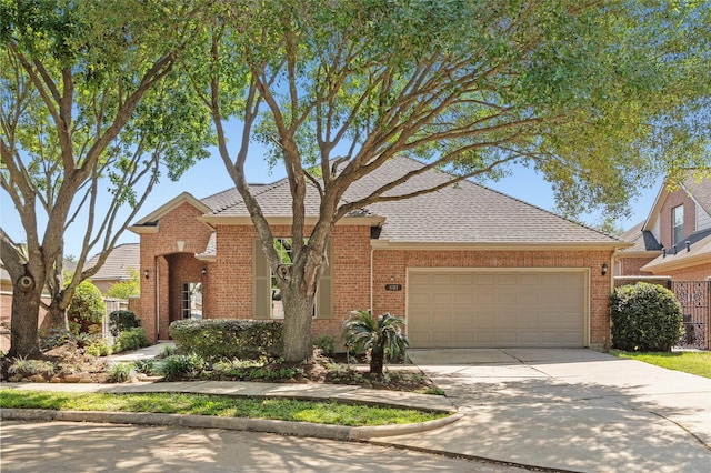 1107 Walden Hill Ct, Houston, TX 77077 - traditional home featuring a garage, brick siding, concrete driveway, and roof with shingles