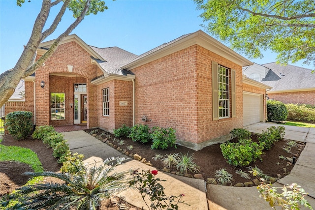 1107 Walden Hill Ct, Houston, TX 77077 - traditional-style home with brick siding, an attached garage, and driveway