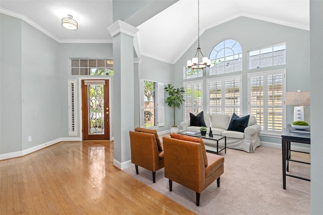 1107 Walden Hill Ct, Houston, TX 77077 - living area featuring a chandelier, baseboards, high vaulted ceiling, and wood-type flooring