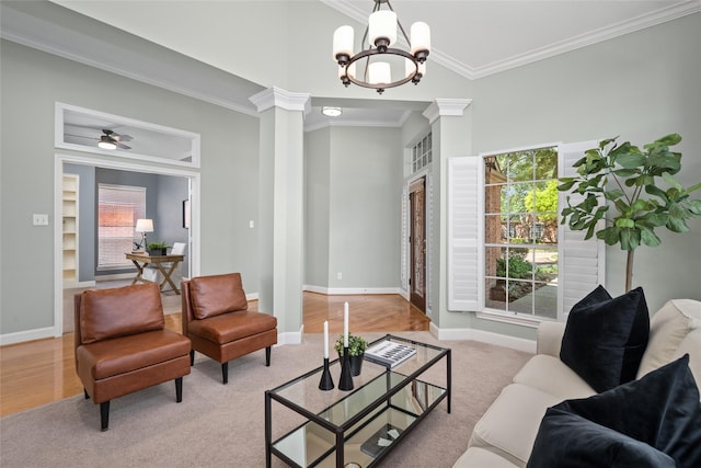 1107 Walden Hill Ct, Houston, TX 77077 - living area featuring ornamental molding, decorative columns, light carpet, baseboards, and a chandelier