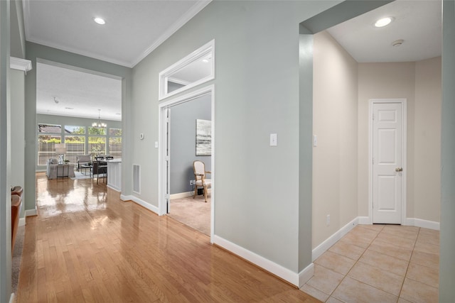 1107 Walden Hill Ct, Houston, TX 77077 - corridor featuring baseboards, ornamental molding, light wood-style floors, and recessed lighting