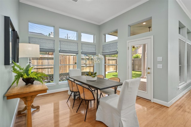 1107 Walden Hill Ct, Houston, TX 77077 - sunroom / solarium featuring baseboards, plenty of natural light, ornamental molding, and wood finished floors
