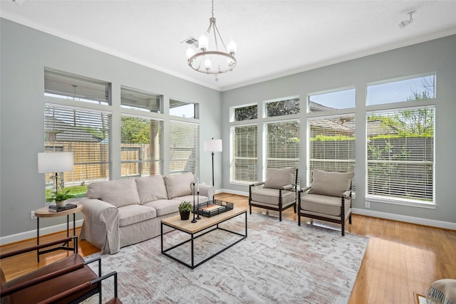 1107 Walden Hill Ct, Houston, TX 77077 - living room featuring a chandelier, crown molding, baseboards, and wood finished floors