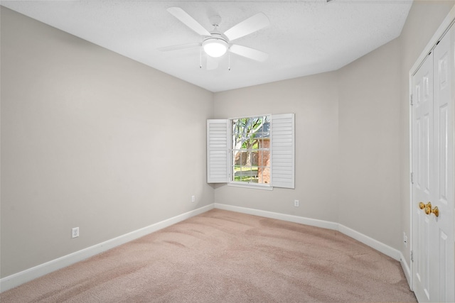 1107 Walden Hill Ct, Houston, TX 77077 - unfurnished bedroom with light carpet, baseboards, a closet, and a ceiling fan