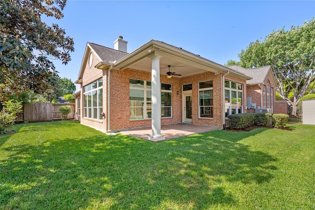 1107 Walden Hill Ct, Houston, TX 77077 - back of property featuring brick siding, ceiling fan, a patio area, and a chimney