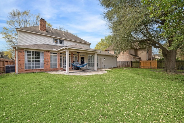 15314 Ripplewind Ln, Houston, TX 77068 - back of house featuring a chimney, a patio area, brick siding, central AC, and a ceiling fan