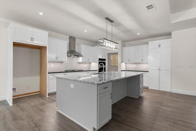 28200 E Stallion Ln, Waller, TX 77484 - kitchen featuring wall chimney range hood, appliances with stainless steel finishes, backsplash, white cabinetry, and recessed lighting