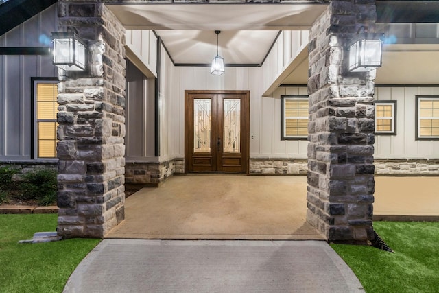 28200 E Stallion Ln, Waller, TX 77484 - entrance to property featuring stone siding, board and batten siding, and french doors