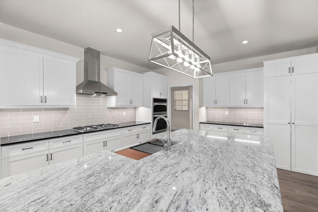 28200 E Stallion Ln, Waller, TX 77484 - kitchen with wall chimney exhaust hood, stainless steel appliances, a sink, decorative backsplash, and white cabinets