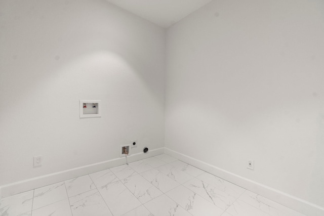 28200 E Stallion Ln, Waller, TX 77484 - laundry area featuring hookup for a washing machine, light marble finish floors, baseboards, and hookup for an electric dryer