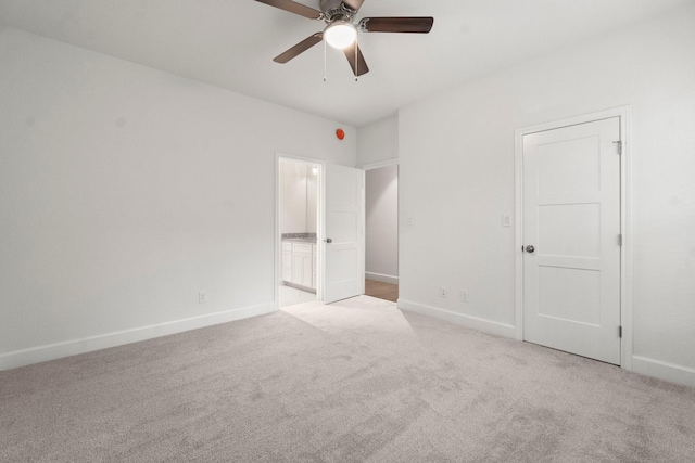 28200 E Stallion Ln, Waller, TX 77484 - unfurnished bedroom with carpet flooring, baseboards, ensuite bathroom, and a ceiling fan