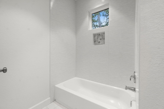 28200 E Stallion Ln, Waller, TX 77484 - full bathroom featuring shower / bath combination and baseboards