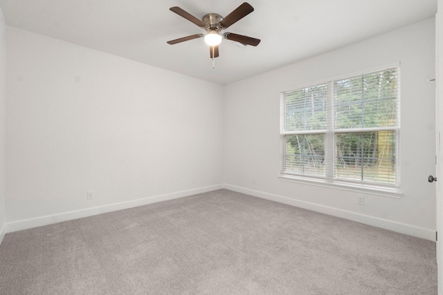28200 E Stallion Ln, Waller, TX 77484 - spare room featuring carpet, baseboards, and a ceiling fan