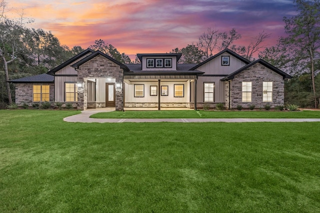 28200 E Stallion Ln, Waller, TX 77484 - view of front of home with stone siding and a lawn