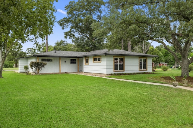 606 Clayton St, Tomball, TX 77375 - ranch-style house featuring a front yard