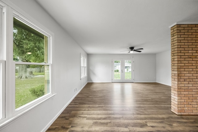 606 Clayton St, Tomball, TX 77375 - unfurnished room featuring dark wood-style flooring, ceiling fan, baseboards, and french doors