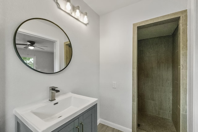 606 Clayton St, Tomball, TX 77375 - full bath featuring a ceiling fan, vanity, tiled shower, and baseboards
