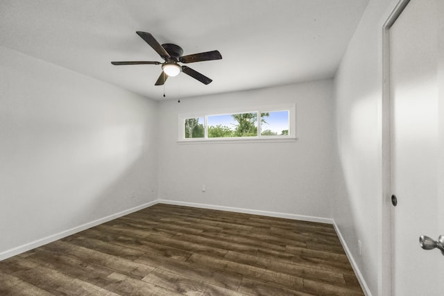 606 Clayton St, Tomball, TX 77375 - empty room featuring dark wood-style flooring, baseboards, and a ceiling fan