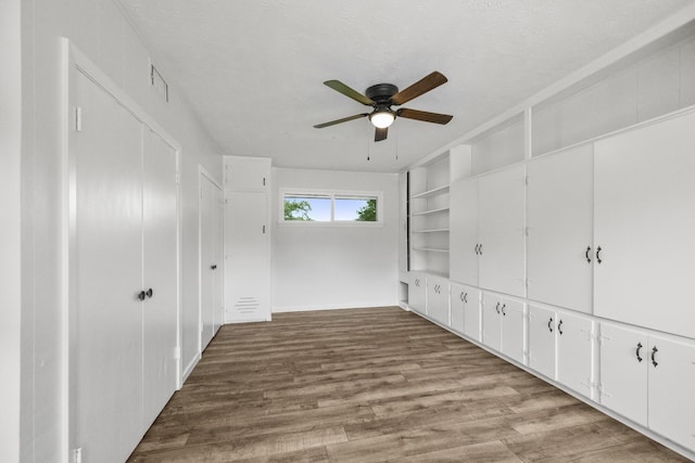 606 Clayton St, Tomball, TX 77375 - unfurnished bedroom featuring wood finished floors and ceiling fan