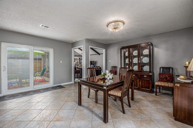 3706 Autumn Ln, Baytown, TX 77521 - dining area with a textured ceiling and baseboards