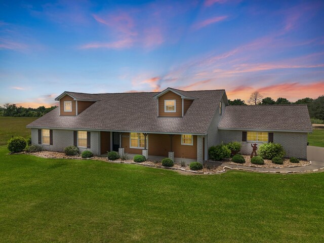 14624 Dove Ln, Needville, TX 77461 - view of front of property with roof with shingles, a lawn, and brick siding