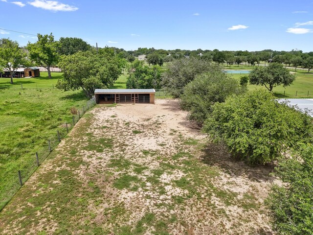 14624 Dove Ln, Needville, TX 77461 - view of front of home featuring an exterior structure, an outdoor structure, a water view, and an outbuilding