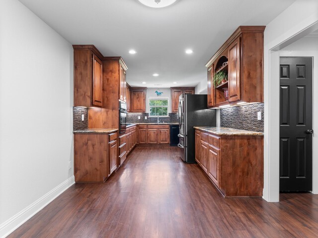 14624 Dove Ln, Needville, TX 77461 - kitchen with freestanding refrigerator, black dishwasher, wall oven, dark wood finished floors, and recessed lighting