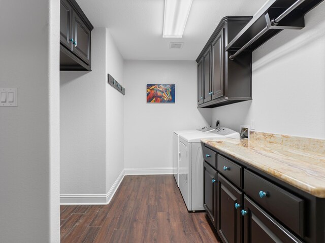 14624 Dove Ln, Needville, TX 77461 - washroom featuring cabinet space, washer and clothes dryer, dark wood-style floors, and baseboards