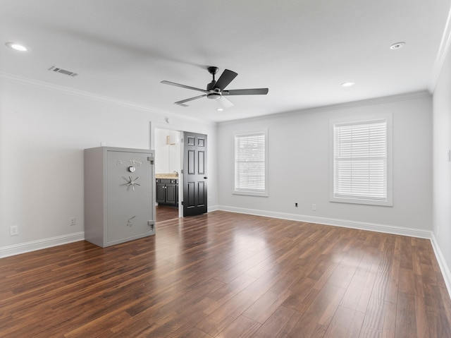 14624 Dove Ln, Needville, TX 77461 - unfurnished living room featuring ceiling fan, crown molding, baseboards, dark wood-style floors, and recessed lighting