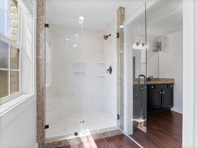 14624 Dove Ln, Needville, TX 77461 - bathroom with a marble finish shower, vanity, and wood finished floors