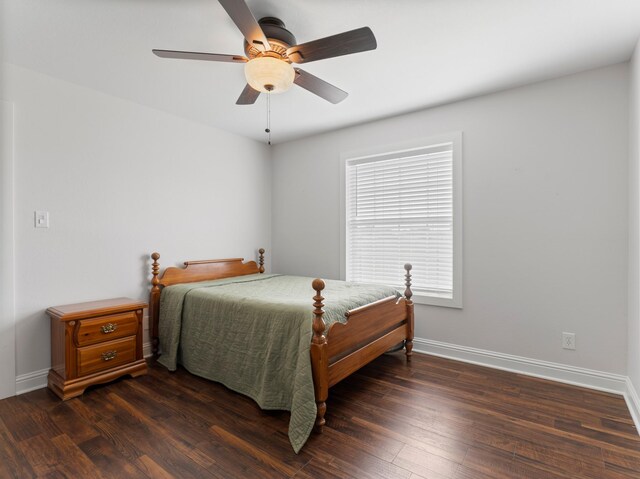 14624 Dove Ln, Needville, TX 77461 - bedroom with dark wood-style flooring, baseboards, and ceiling fan