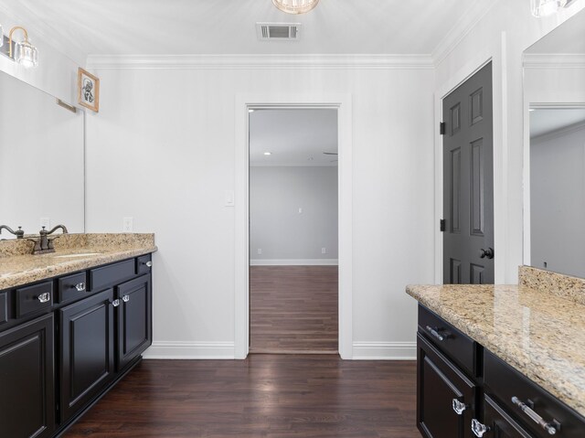 14624 Dove Ln, Needville, TX 77461 - bathroom with baseboards, vanity, wood finished floors, and crown molding