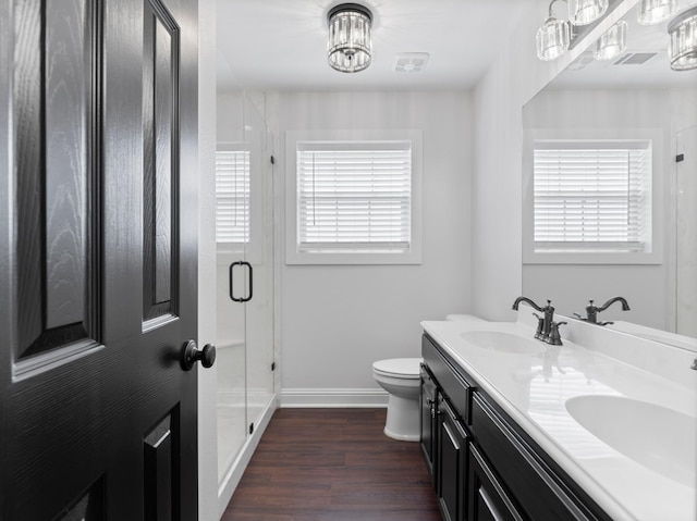 14624 Dove Ln, Needville, TX 77461 - full bath with plenty of natural light, toilet, a stall shower, and wood finished floors