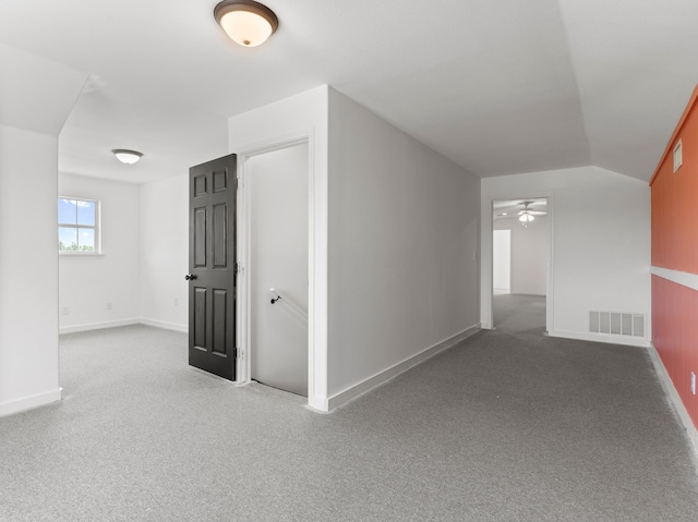 14624 Dove Ln, Needville, TX 77461 - empty room featuring ceiling fan, carpet flooring, baseboards, and lofted ceiling