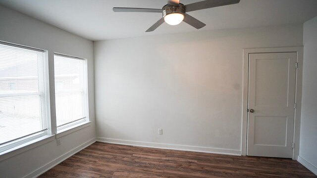 1126 Ryon St, Houston, TX 77009 - empty room featuring healthy amount of natural light, dark wood-type flooring, and baseboards